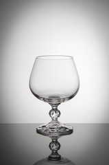 
Glass goblet on white background in vignette