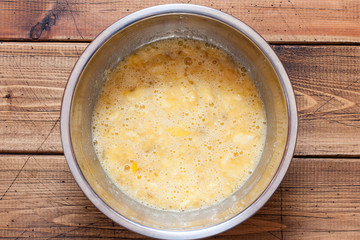 Step by step preparation of banana bread, step 3 - mixing the ingredients, top view, selective focus