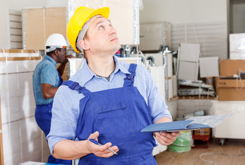 Male contractor determining scope of work