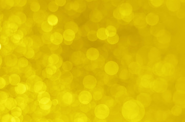 abstract yellow bokeh glitter sparkle background.
