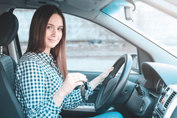 Woman shows car keys, woman driving her car