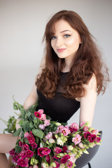 girl in black bodysuit with flowers