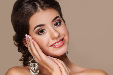 Portrait of a beautiful girl with a perfect smile and bright makeup, perfect skin, skincare, spa, cosmetology.