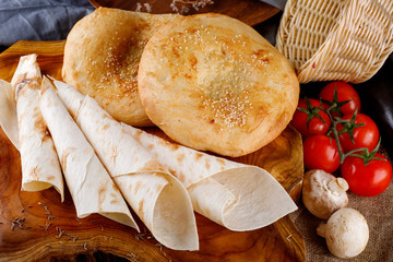 Different types of bread on a wooden Board
