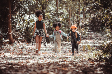 Children hiking in mountains or forest. Kids Camping summer. Two funny little girls having fun...