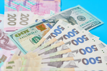 Different money on blue background. Payment of pensions, salaries. Bank loan. Business concept