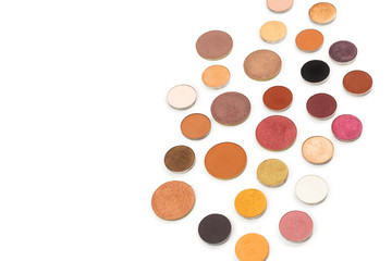Round multicolored make up eyeshadows isolated on white.