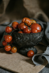 Bowl of Tomatoes on Rustic on a gray background