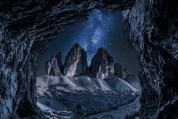 Milky way and Tre Cime di Lavaredo from cave, Dolomites