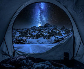 View from tent to Morskie Oko at night in winter © shaiith