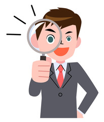 虫眼鏡をのぞきこむ若いビジネスマン