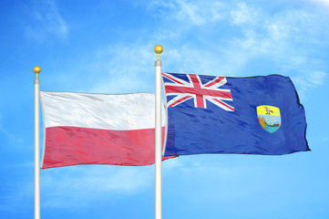 Poland and Saint Helena two flags on flagpoles and blue cloudy sky