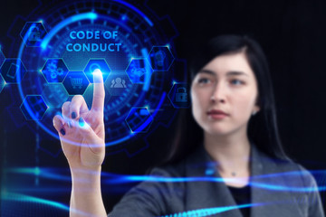 Business, Technology, Internet and network concept. Young businessman working on a virtual screen of the future and sees the inscription: Code of conduct