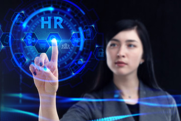 Business, Technology, Internet and network concept. Young businessman working on a virtual screen of the future and sees the inscription: HR