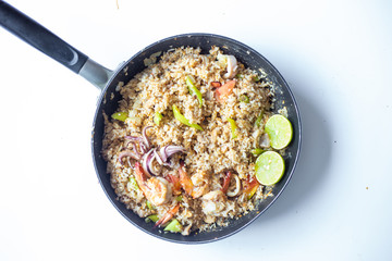 Asian fried rice with tiger prawn shrimp and seafood.