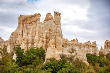Natural chimneys made up of columns of soft rock, eroded by rain in Les Orgues d'illes sur Tet. Languedoc Roussillon, France - 335825220