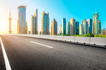 Shanghai urban architecture landscape and empty asphalt road in summer sunrise