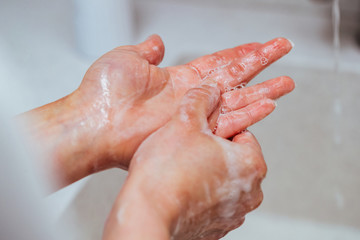 Close-up of washing hands with soap.