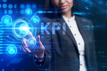 Business, Technology, Internet and network concept. Young businessman working on a virtual screen of the future and sees the inscription: KPI