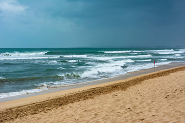 Empty or deserted Kuta Beach in Badung Regency, Bali, Indonesia. Government has been urging people to stay at home to reduce the spread of covid-19 pandemic. Tourism is hit hard with this pandemic.