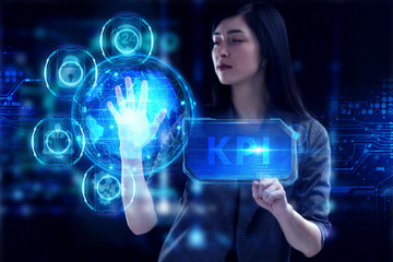 Business, Technology, Internet and network concept. Young businessman working on a virtual screen of the future and sees the inscription: KPI