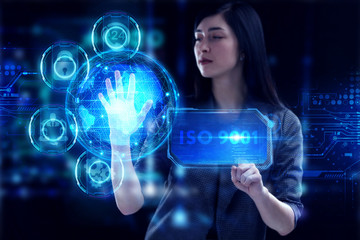 Business, Technology, Internet and network concept. Young businessman working on a virtual screen of the future and sees the inscription: ISO 9001