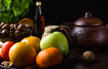vegetables and fruits on the black table, herbs, honey and nuts