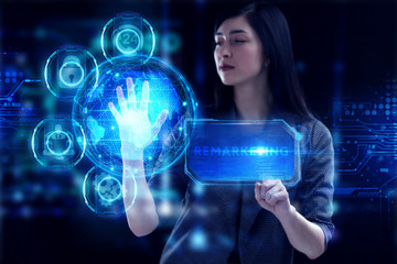 Business, Technology, Internet and network concept. Young businessman working on a virtual screen of the future and sees the inscription: Remarketing