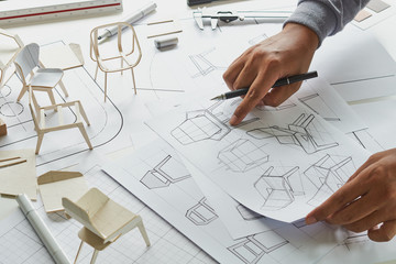 Designer sketching drawing design development product plan draft chair armchair Wingback Interior furniture prototype manufacturing production. designer studio concept .