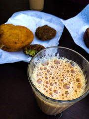 Nice srtong kerala tea with tasty fried dishes,