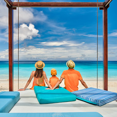 Family with three year old boy on beach. Seychelles, Mahe.