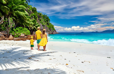 Family with three year old boy on beach. Seychelles, Mahe.