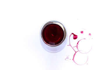 A glass of pink red wine on white background with Traces of wine. Free copy space.  Concept of organic drinks. TOP VIEW