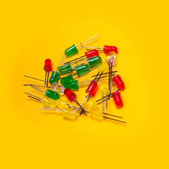  Red, blue, green or yellow transparent plastic electronic components over yellow