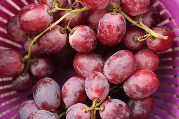 Fresh red grapes on the table macro