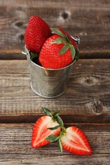 Delicious juicy strawberries on a wooden table