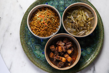 Luxury setting of traditional southern Thai foods with background of white marble.
