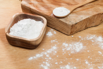 Baking soda - sodium bicarbonate Natural powder, photo on wooden background.