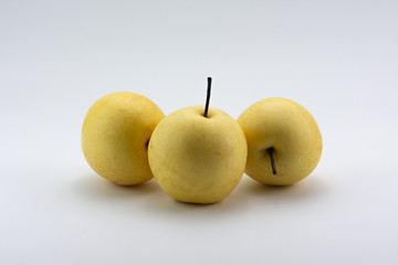 Yellow fresh pears on a white background.