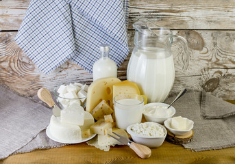 Fresh dairy products on a wooden table.
