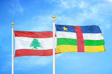 Lebanon and Central African Republic  two flags on flagpoles and blue cloudy sky