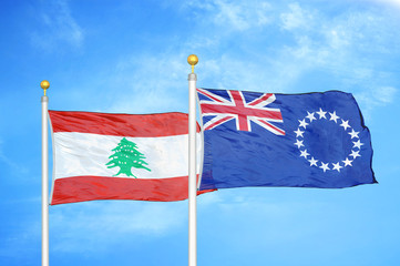 Lebanon and Cook Islands two flags on flagpoles and blue cloudy sky
