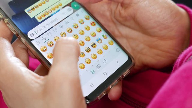 woman sends  emoticons on an instant messaging application