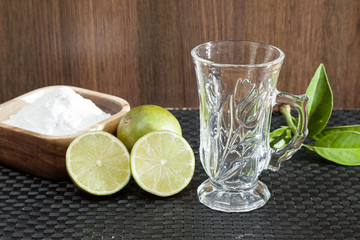 Baking soda - sodium bicarbonate, hot water and lemon. 