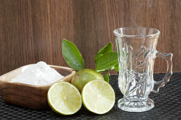 Baking soda - sodium bicarbonate, hot water and lemon. 