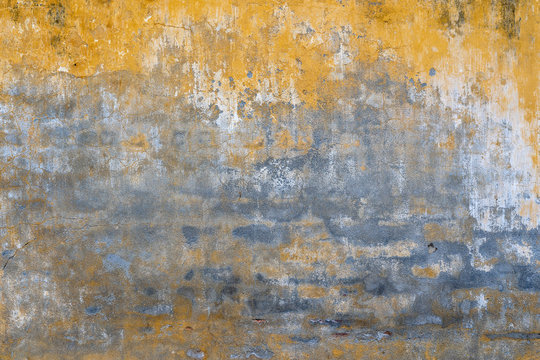 Background of old yellow painted wall texture