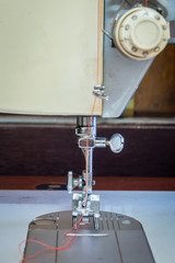 Sewing machine on table in workshop