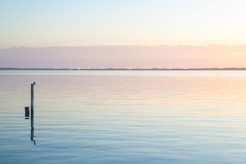 Sunrise reflections at Bacalar Lake in Quintana Roo, Mexico