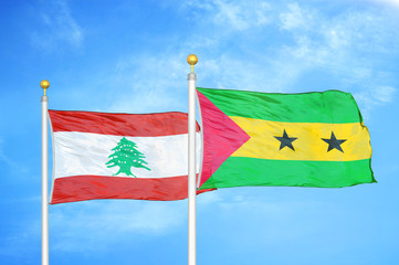 Lebanon and Sao Tome and Principe two flags on flagpoles and blue cloudy sky