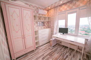 Interior for a little girl's bedroom in pink color